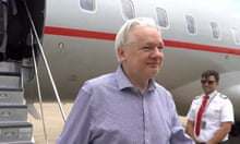 Julian Assange steps off his flight from London in Bangkok for a layover at Don Mueang airport in the Thai capital