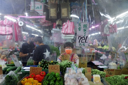 Masks and plastic sheets have been used in stores in Taipei to prevent the spread of Covid.