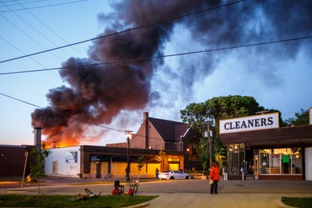 Flames rise from the cleaners shoop near the Third Police Precinct on May 28, 2020 in Minneapolis, Minnesota, during a protest over the death of George Floyd.