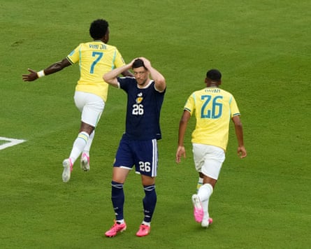 Vinícius Júnior and Rayan celebrate as Scott McKennaholds his head in his hands.