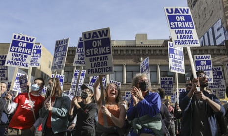 Image of students striking against lower pay