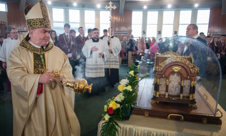 Bishop Joseph Toal, the bishop of Motherwell, blesses the relics of Saint Thérèse of Lisieux at their first stop at St Francis Xavier’s, Carfin, North Lanarkshire.