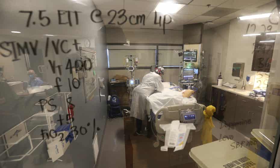 An intensive care unit in Bakersfield, California. Healthcare workers tend to a patient