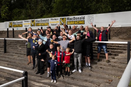 The Merthyr Town FC fans who started the Dial M For Merthyr fanzine are pictured with friends and family. Second left is Mark, with his dad David, son Nathan with grandson Osian on his shoulders.