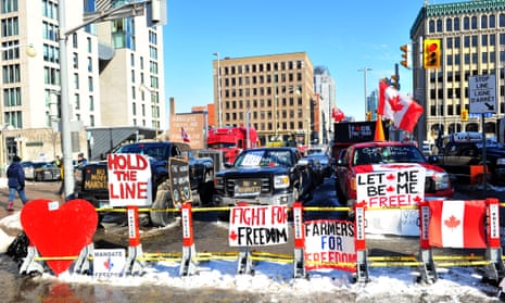 Protesters gather near the parliament hill as truckers continue to protest in Ottawa.