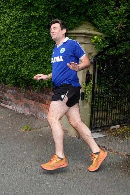 Andy Burnham in short shorts and Everton top.