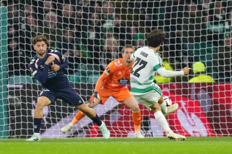 Celtic's Mika Baur shoots past the goalkeeper to score against Celta Vigo