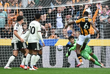 Semi Ajayi fires past Senne Lammens to put Hull ahead.