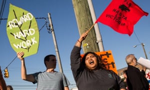 Activists shout during a Farm Labor Organizing Committee protest over pay and conditions in Durham, North Carolina.