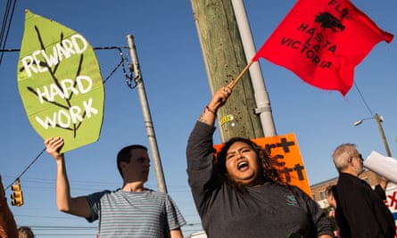 Activists shout during a Farm Labor Organizing Committee protest over pay and conditions in Durham, North Carolina.