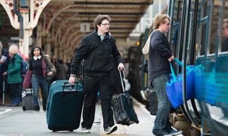 Passengers board a train at Aberystwyth station.