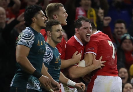 Wales’ hooker Ryan Elias (second right) celebrates with teammates after he scores a try.