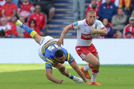 Mikey Lewis breaks a tackle during Hull KR’s win over Warrington.