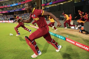 Darren Sammy, captain of the West Indies, runs on to the field to celebrate his team’s win over India in the World Twenty20 semi-final at the Wankhede stadium.