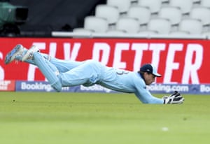 Jos Buttler dives to take the catch to dismiss Afghanistan’s captain Gulbadin Naib.