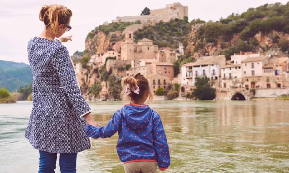 Mother and daughter enjoying view of the Ebro river in Catalonia.