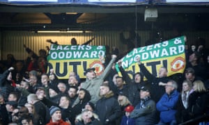 Manchester United fans display banners in the away end at Goodison Park.