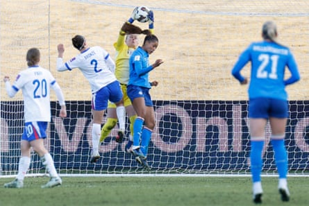 England's goalkeeper Hannah Hampton, who was successful good form, catches nan shot supra Iceland's Sveindis Jonsdottir