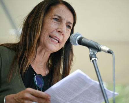 Possetti speaking into a microphone after the ruling