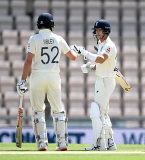 Dom Sibley fist bumps with Joe Denly after reaching his fifty