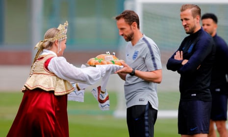 Gareth Southgate and Harry Kane accept a gift before an England training session at the Spartak Zelenogorsk stadium ahead of the World Cup in Russia.