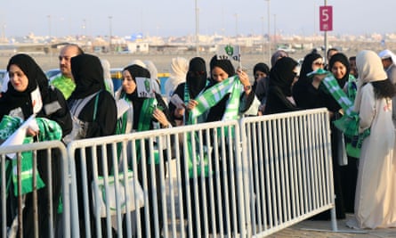 Saudi women queue to get inside the King Abdullah Sports City stadium in Jeddah on Friday.