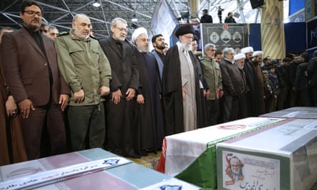 Ayatollah Khamenei, centre, leads a prayer in Tehran over the coffins of Qassem Suleimani and others killed in a US drone strike on Friday.