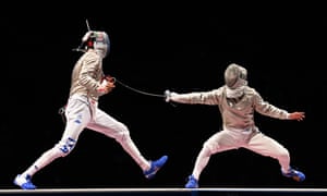 Italy’s Luigi Samele (left) and Hungary’s Aron Szilagyi in the men’s sabre individual gold medal bout.