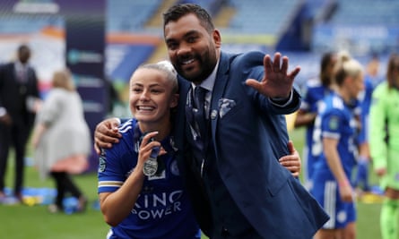 Leicester’s Hannah Cain and Jonathan Morgan enjoy the Championship title presentation in May 2021.