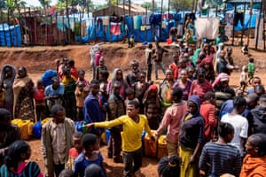 Displaced Gedeo people wait in line with their containers looking for water at Kercha site for displaced persons, West Guji in Ethiopia.