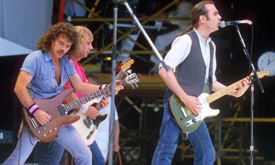 Alan Lancaster (left) with bandmates Rick Parfitt and Francis Rossi opening the Live Aid show at Wembley Stadium in 1985