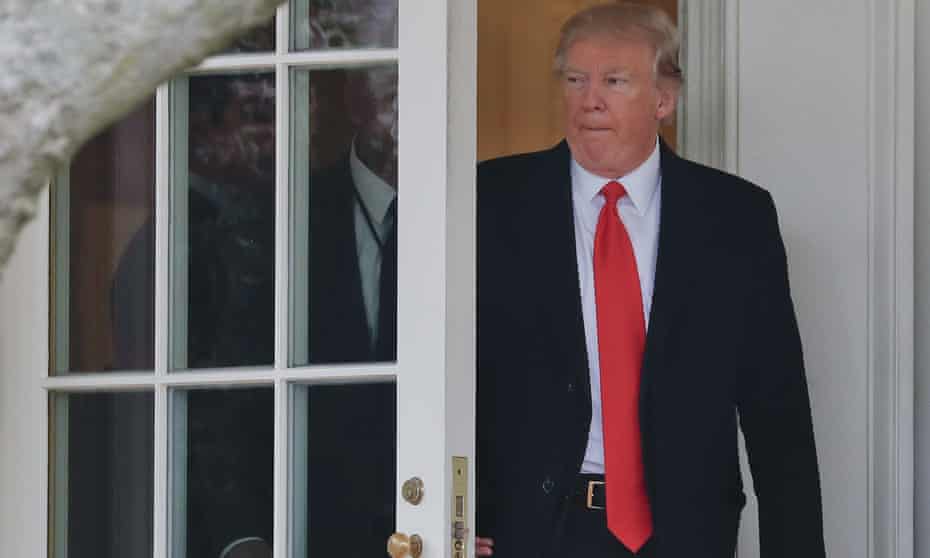 Donald Trump leaves the Oval Office of the White House in Washington on Friday.