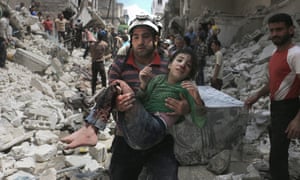 A man carries injured girl after an air-strike on Aleppo on Thursday.