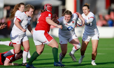 Sarah Bern fends off Wales’s Carys Phillips in the Women’s Six Nations in April.