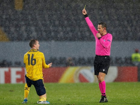 Holding is shown a yellow card by referee Halis Ozkahya.