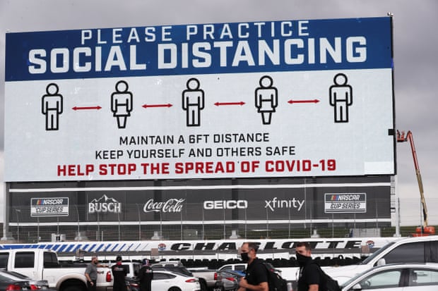 A screen displays a message urging social distancing before a Nascar race in Concord, North Carolina, on 25 May.