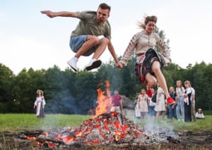 A man and a woman jump over a bonfire during Ivan Kupala Day celebrations in a village near Minsk. Ivan Kupala Day, also known as Ivana-Kupala or Kupala Night, is a traditional pagan holiday celebrated in eastern Slavic cultures
