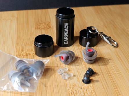parts for the EarPeace Moto earplugs sitting on wooden table