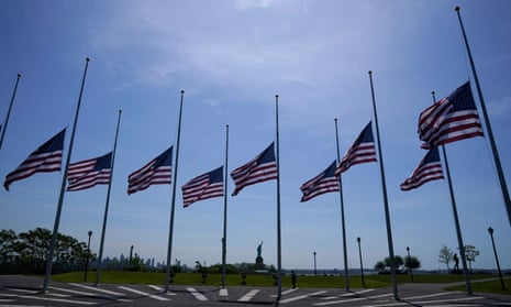 US flags, across New York bay from the Statue of Liberty, fly at half-mast at Liberty State Park in Jersey City, New Jersey, as a mark of respect for the victims of the Texas school shooting.