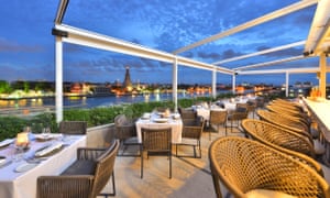 Bangkok city guide: what to do plus the best hotels, restaurants and bars   Bar- at Riva Arun with WatArun at twighlight