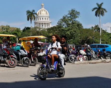 Two people on a motorbike in Havana in January 2026.
