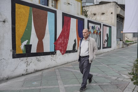A man walks on the streets of Tehran