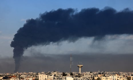 A picture taken from Rafah shows smoke billowing over Khan Yunis in the southern Gaza Strip.