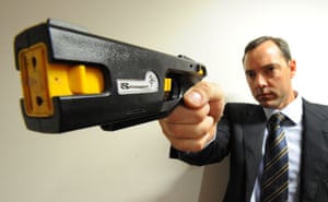 Robert Nioa, displays a new generation stun gun manufactured by his company.