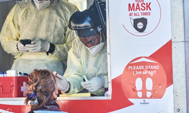 A health worker administers a nasal swab at a Testaro Covid-19 mobile testing site in Johannesburg.
