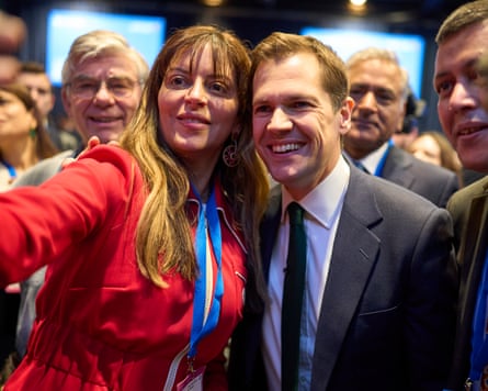Robert Jenrick posing for a photograph with a delegate
