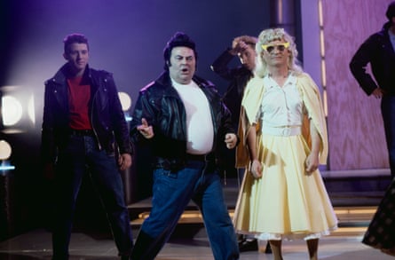 Eddie Large, centre, and Syd Little, right, performing a scene from the musical Grease as part of a sketch for The Little and Large Show, 1991.
