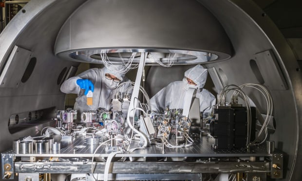 Staff working inside the Virgo gravitational wave detector.