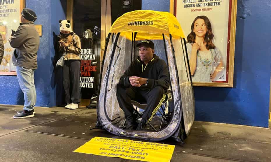 Robert Samuel sits in a tent