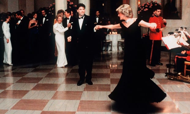 Princess Diana dances with actor John Travolta in a dress designed by Victor Edelstein, at the White House in 1985.